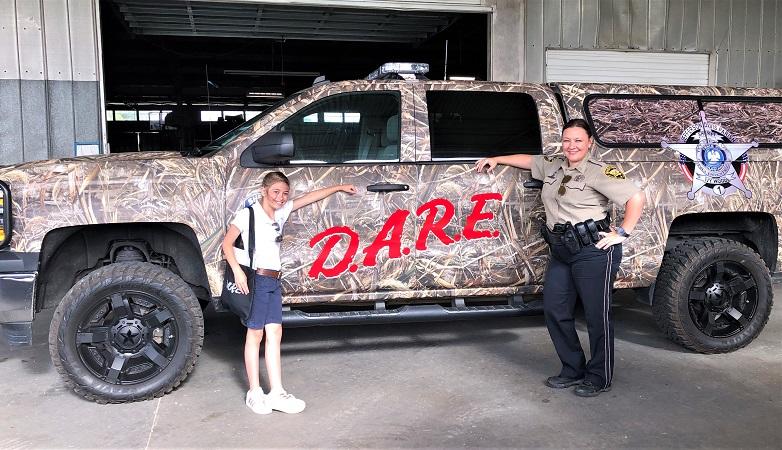 2 D.A.R.E. truck Borne and Miguez NEWSLETTER READY.jpg